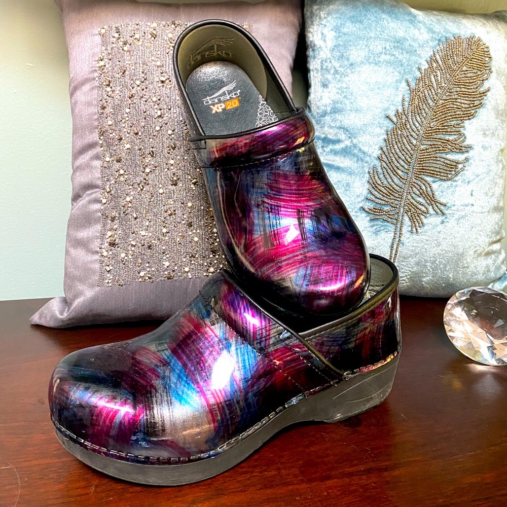 Multi-colored Dansko shoes.